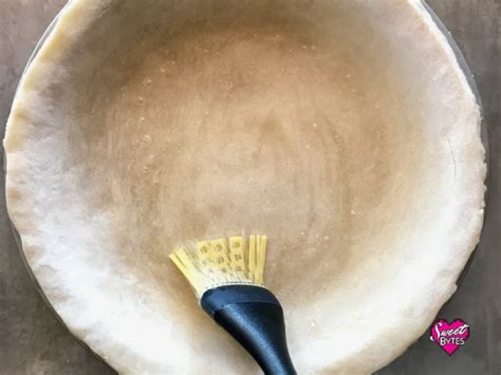 Should I brush my pie crust with egg white?