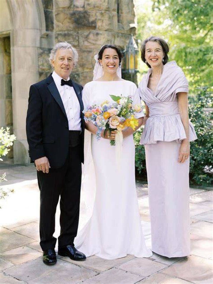 What color does the bride's father wear?