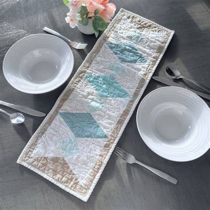 What is the point of a table runner?