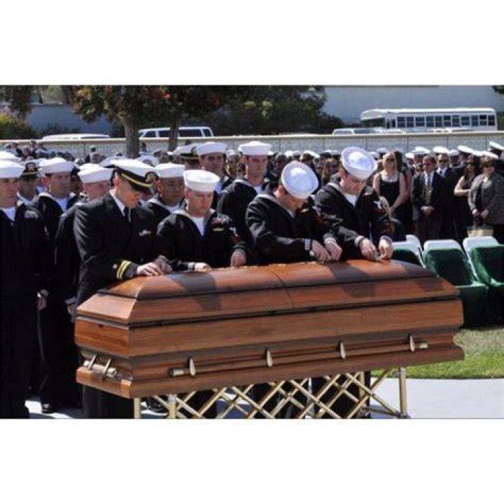 Why do SEALs pin Tridents on caskets?